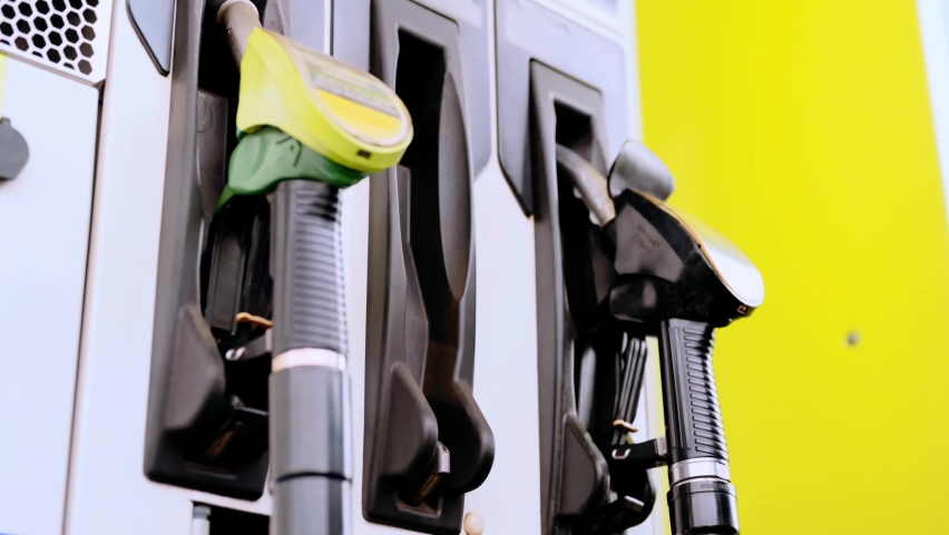 Manual refueling of a car with fuel at a gas station. gasoline dispenser | Shutterstock HD Video #1097390277