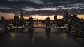 Moody sunset, track in, Establishing Aerial View Shot of London UK, United Kingdom