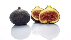 Time lapse of rotting figs on white background, educational video, life and death concept