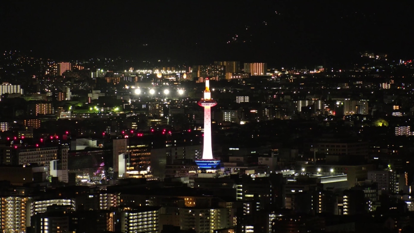 KYOTO, JAPAN - DECEMBER 2021 : Aerial high angle view of Kyoto city at night. Scenery of streets and buildings around Kyoto station. Time lapse shot. Japanese urban nightlife city concept video. | Shutterstock HD Video #1097408271