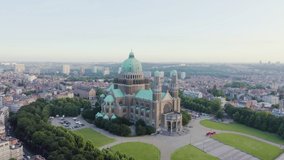 Inscription on video. Brussels, Belgium. National Basilica of the Sacred Heart. Early morning. Blue lights form luminous. Electric style, Aerial View, Point of interest