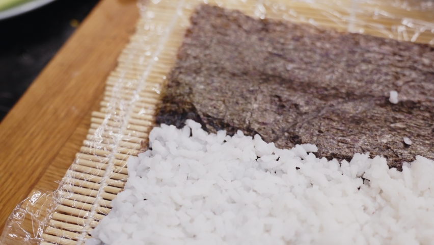 Zooming Out From White Rice On Wooden Mat, Ready For Sushi Preparation  | Shutterstock HD Video #1097410641