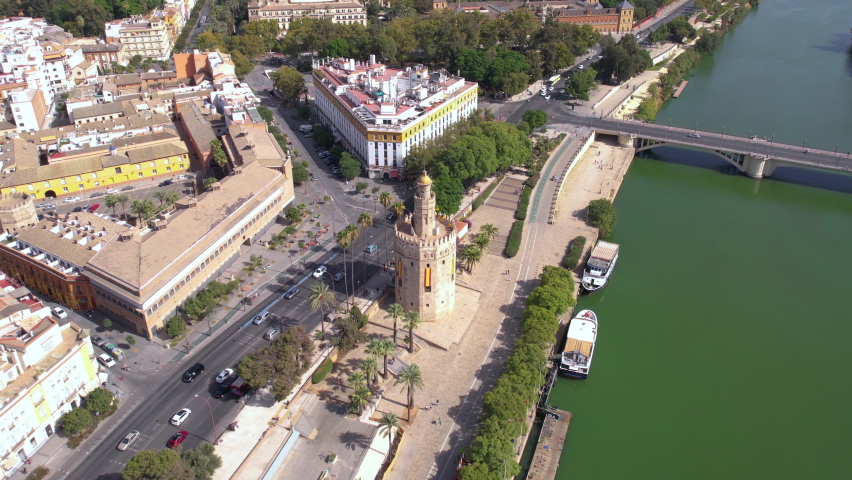Aerial View of Torre del Oro, Seville Spain. Ancient Landmark and Street Traffic on Sunny Day