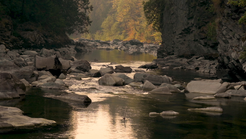 Downstream view of Stillaguamish River on peaceful autumn day. Washington State.