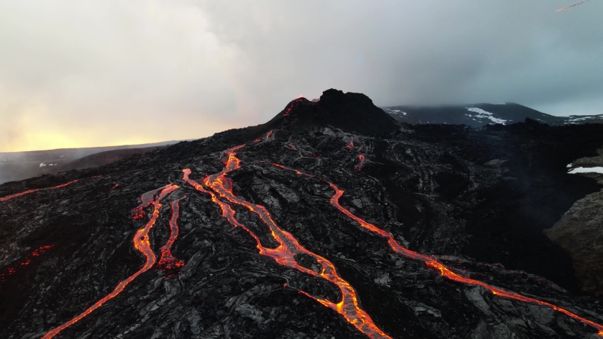 Meteors Asteroids falling from sky over active volcano, Aerial view
Powerfull cinematic view of active volcano with massive meteor shower, Iceland, mount Fagradalsfjall, 2022
