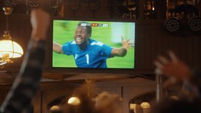Friends Cheering for Their Soccer Team, Playing in an International Cup Final. Supportive Fans Standing in a Bar, Cheering, Raising Hands and Shouting. People Celebrate When Team Scores a Goal. - Powered by Shutterstock - Get 15% off with code: PIKWIZARD15