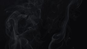 Smoke on a black background in slow motion, beautiful clean and white from natural wooden fire, beautiful abstract background. Filmed on cinema camera, 8K downscale, 4K.