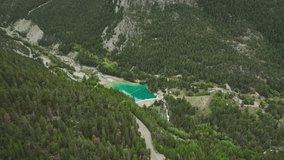 Water dam Melezet surrounded by forest  in Italian alps aerial shot  - Powered by Shutterstock - Get 15% off with code: PIKWIZARD15