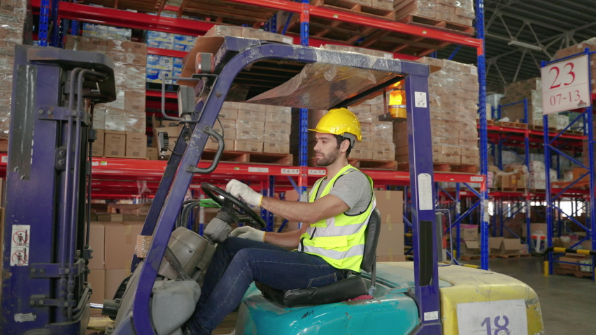 Forklift driver worker working inside the warehouse, concept of distribution, storage, transport, logistics | Shutterstock HD Video #1097432333