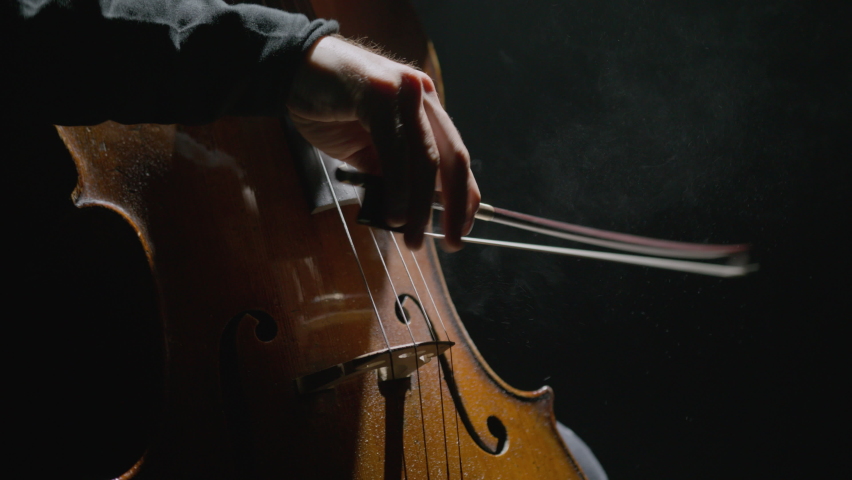 Footage of male hands playing cello violoncello . Musician man plays in beautiful contrabass on stage in concert . Close up . Shot on Red Komodo movie camera | Shutterstock HD Video #1097432417
