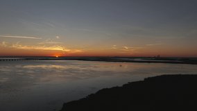 Sun disappearing into the horizon near Mobile Bay, Alabama