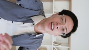 Vertical video. Vlogger interview. Social media communication. Happy enthusiastic smiling guy greeting waving hello talking recording fun content. - Powered by Shutterstock - Get 15% off with code: PIKWIZARD15