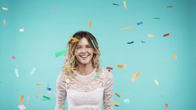 Woman, jump and dancing for confetti party in studio or birthday, new years event and celebration. Young happy girl, dance energy and celebrate comic disco fun or dancer smile in blue background - Powered by Shutterstock - Get 15% off with code: PIKWIZARD15