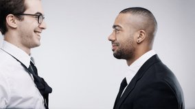 Fight, comic and business men slapping, work communication and funny against a white studio background. Disagree, comedy and diversity with playful, crazy and young employees giving face slap - Powered by Shutterstock - Get 15% off with code: PIKWIZARD15