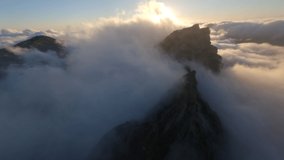 FPV Drone View of Pico de Areiro over the clouds during sunrise