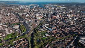 Aerial Video of Residential homes and Business in Belfast City Skyline Cityscape Northern Ireland