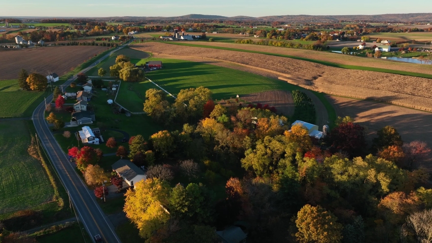 Long shadows in autumn season on rural farm fields in Pennsylvania USA. Aerial view.