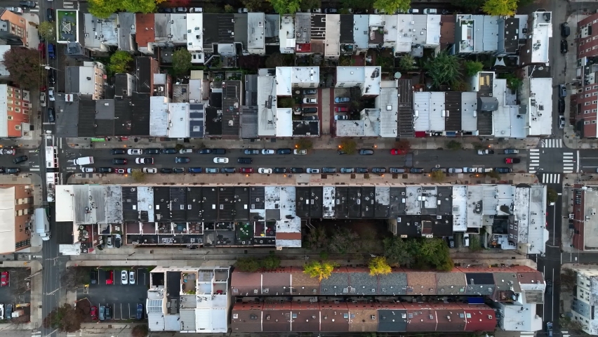 Rooftop view in urban American city. Top down aerial truck shot above street in autumn.