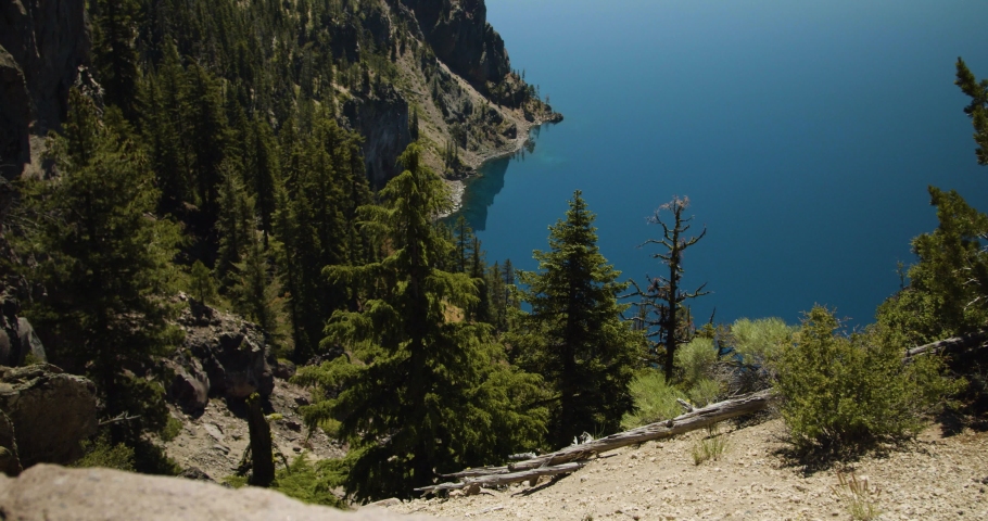 Trees and cliffs leading down to a lake