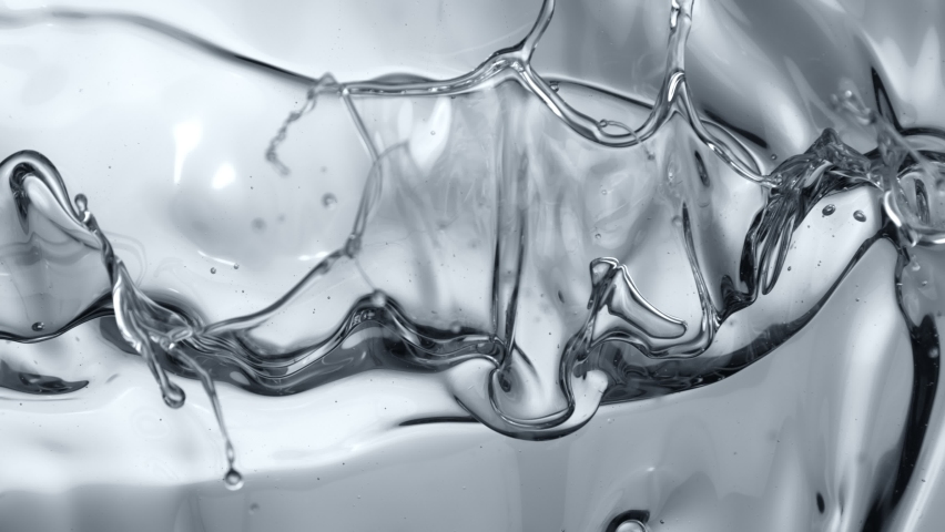 Super Slow Motion Shot of Splashing Transparent Oil Waves at 1000fps. | Shutterstock HD Video #1097462641