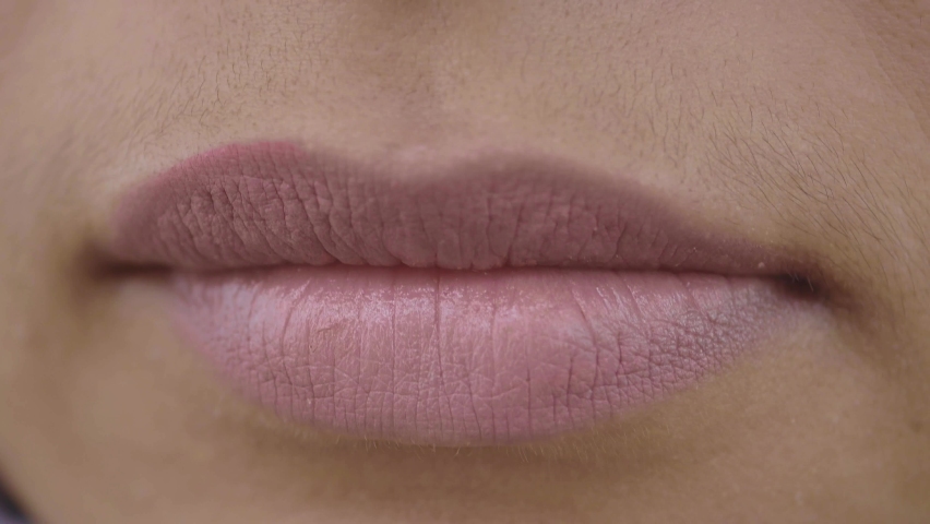 Woman using petroleum jelly onto lip  | Shutterstock HD Video #1097464137