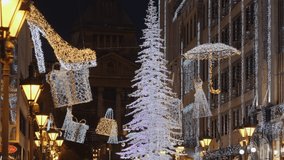 Beautiful Christmas season street scene with glowing Christmas tree, lights, urban decorations and lanterns in central part of Budapest at night, Hungary - Powered by Shutterstock - Get 15% off with code: PIKWIZARD15