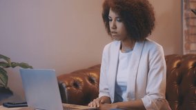 Young African American businesswoman having online video conference at home, app