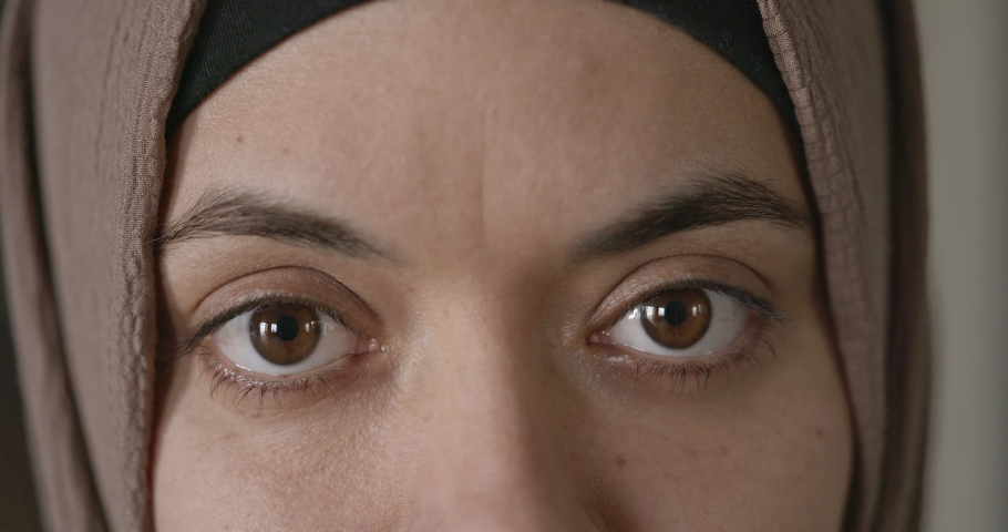 Close-up eyes of woman in hijab looking at camera | Shutterstock HD Video #1097476547