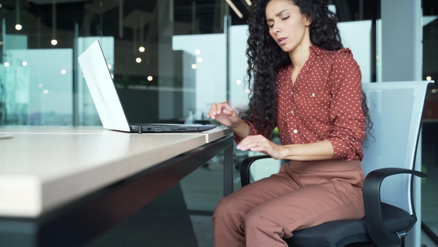 Business woman has severe pain in leg muscle spasm varicose veins, massaging Female employee suffers from sprained joint acute pain indoors sitting at the workplace Worker feeling calf painful Royalty-Free Stock Footage #1097478209