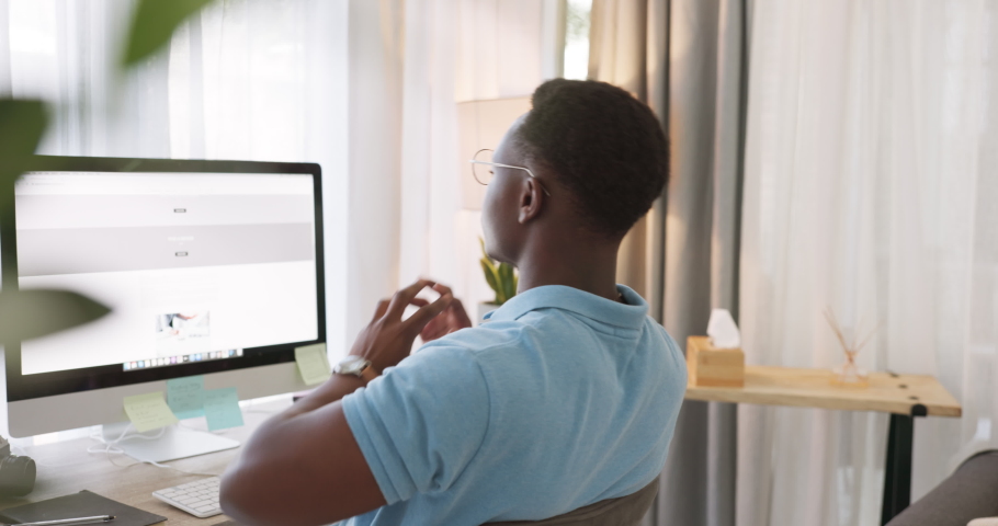 Computer, black man and stretching in work from home office for remote work at desktop, technology or internet planning. Tired freelancer, arms stretch and body movement for energy from fatigue at pc | Shutterstock HD Video #1097481435