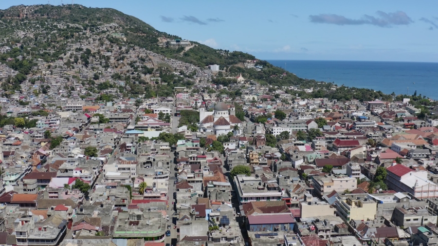 Our Lady of the Assumption Cathedral, located in the city of Cap-Haïtien in the Department of the North in the Hispaniola island and to the north of the Caribbean country of HAITI. Streets around. Royalty-Free Stock Footage #1097485135