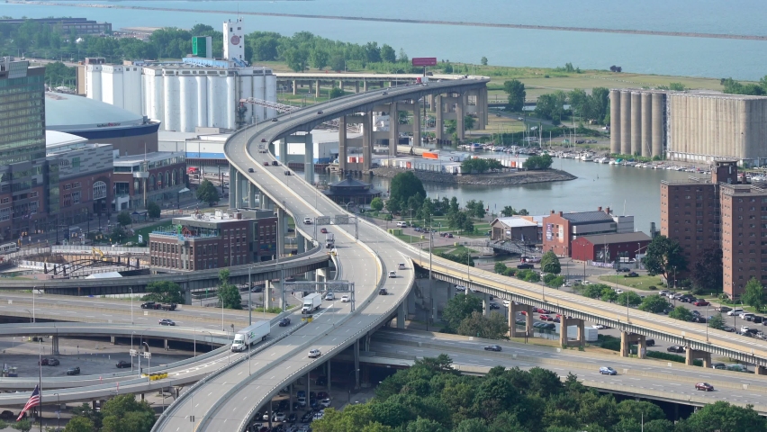 An aerial view of the city of Buffalo, New York and its infrastructure of bridges and buildings beside Lake Erie.