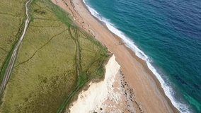 Cinematic drone video revealing Durdle Door and Dorset coastline