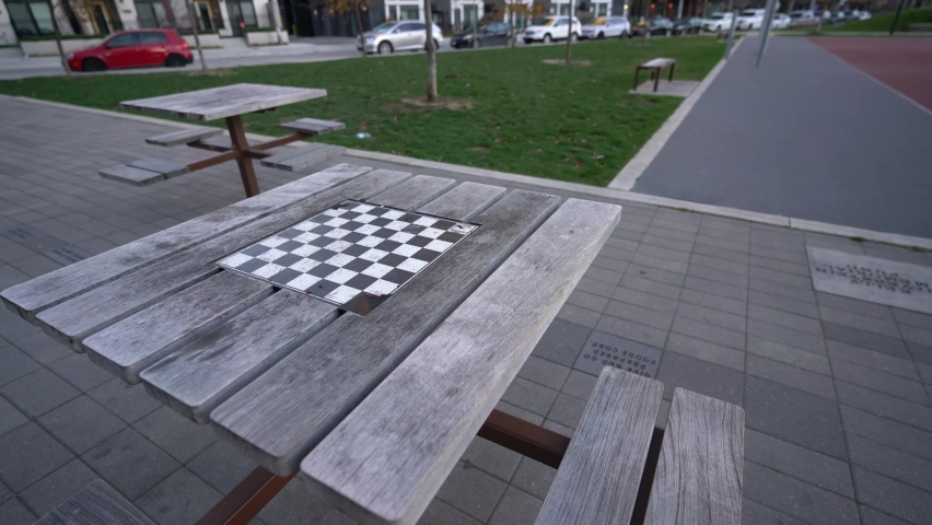 Pan of outdoor chess picnic table at park, empty no people | Shutterstock HD Video #1097487653