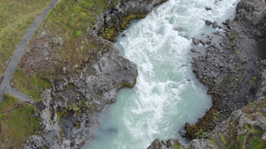 Top down aerial of Godafoss waterfall powerfull stream of glacier water