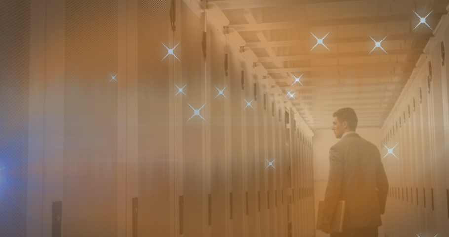 Animation of stars over caucasian businessman in server room. Global business, computing and digital interface concept digitally generated video. | Shutterstock HD Video #1097490913