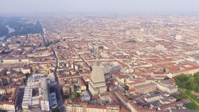 Inscription on video. Turin, Italy. Flight over the city. Mole Antonelliana - a 19th-century building with a 121 m high dome and a spire. Glitch effect text, Aerial View
