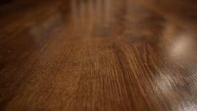 close-up texture of wooden parquet with natural pattern. Video partially out of focus
