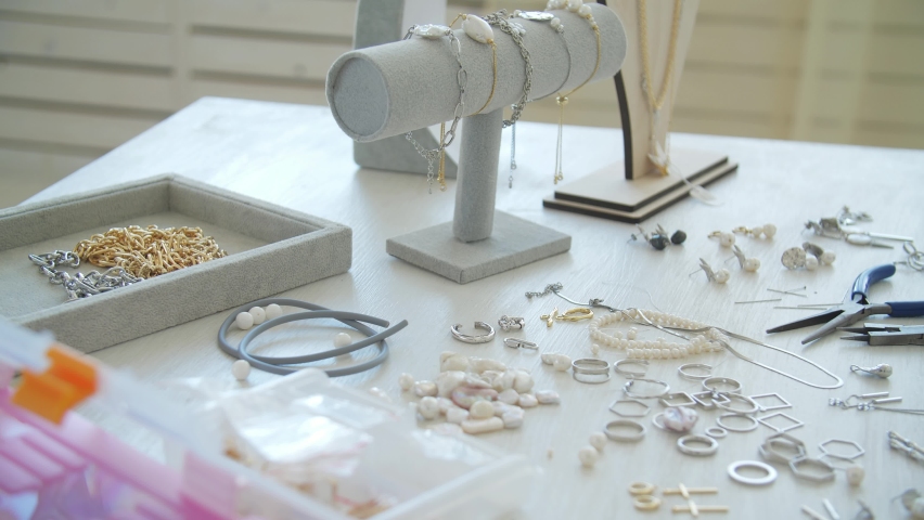 Hobby or small business concept. Workplace of a jeweler. Tools on the table | Shutterstock HD Video #1097506025
