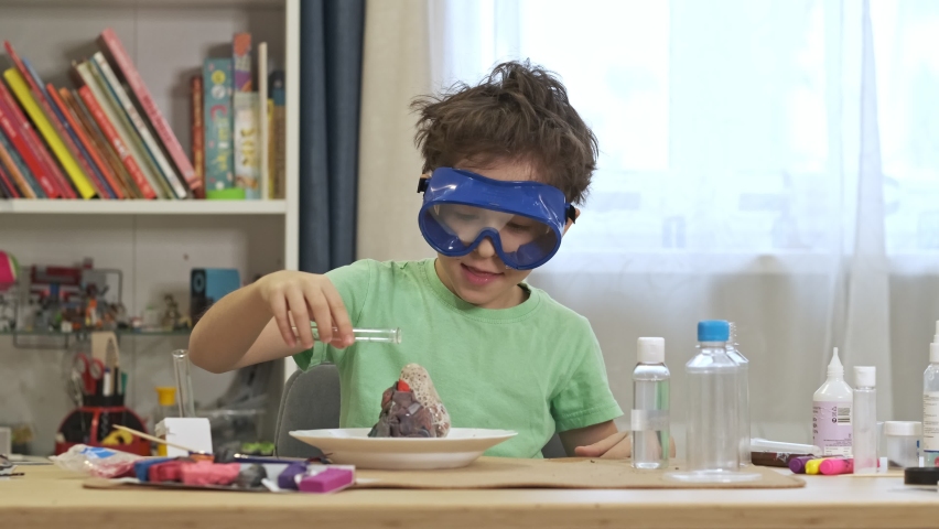 Boys cientist doing experiments. Education concept. Preschooler interests. Smart little child doing chemical research at home laboratory. Dangerous experiment. Home activities for children. | Shutterstock HD Video #1097507963