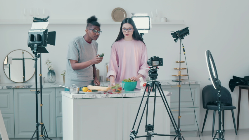 Video shoot of two young people cooking together | Shutterstock HD Video #1097516263