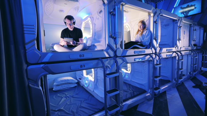 Young people are resting in the capsule hotel units