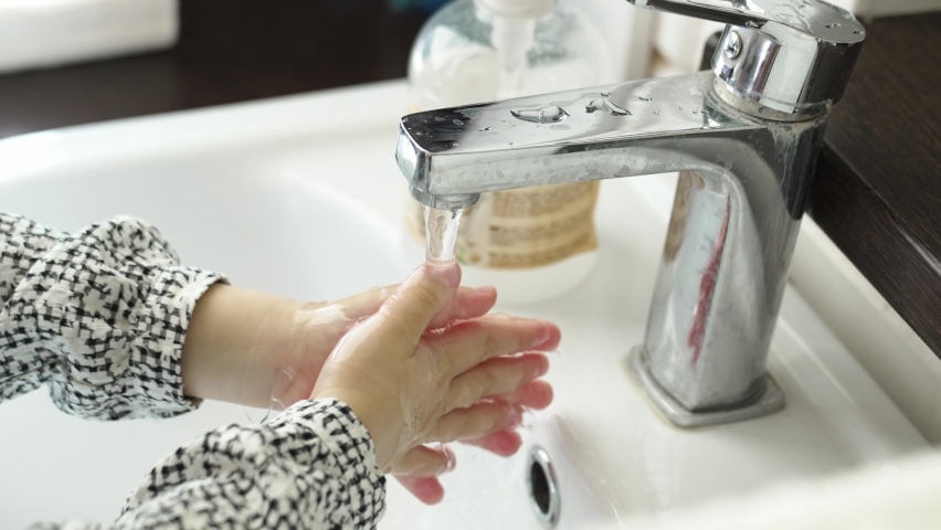 Washing children's hands with soap in the sink. the concept of hygiene in kindergartens and schools. mandatory hand washing before eating and after a walk. | Shutterstock HD Video #1097516415