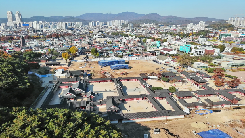 Suwon: Aerial view of city in South Korea, fortress Hwaseong Haenggung, clear blue sky - landscape panorama of Eastern Asia from above