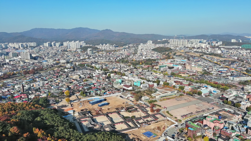 Suwon: Aerial view of city in South Korea, fortress Hwaseong Haenggung, clear blue sky - landscape panorama of Eastern Asia from above