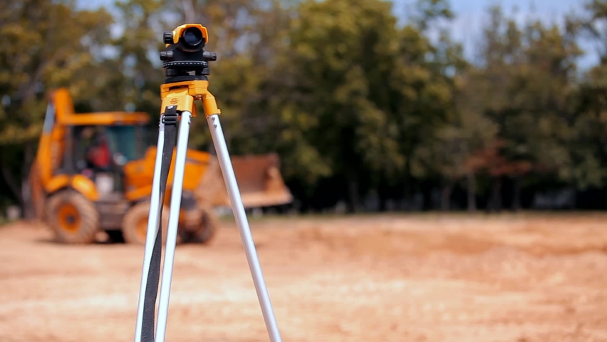 Geodesy at a construction site. Professional total station close-up. Construction equipment. Royalty-Free Stock Footage #1097518405