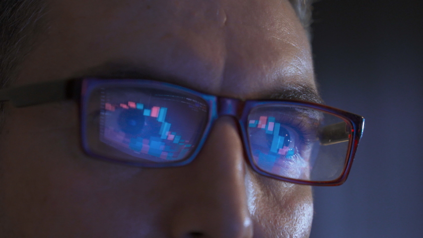 Close-up stock market monitoring.
Graphs are reflected in the glasses of the man who follows the stock market from his computer.
 | Shutterstock HD Video #1097523917