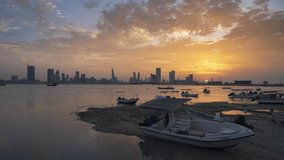 4k Day to Night Time lapse video of Manama city with amazing clouds.