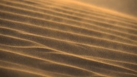Wind carries the sand along the dune in the desert. Slow motion shot of Desert sand dunes ripples in the wind - Powered by Shutterstock - Get 15% off with code: PIKWIZARD15