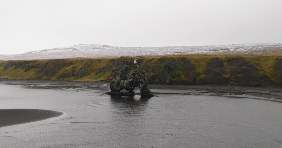 aerial view of hvitserkur basalt rock with waterfall